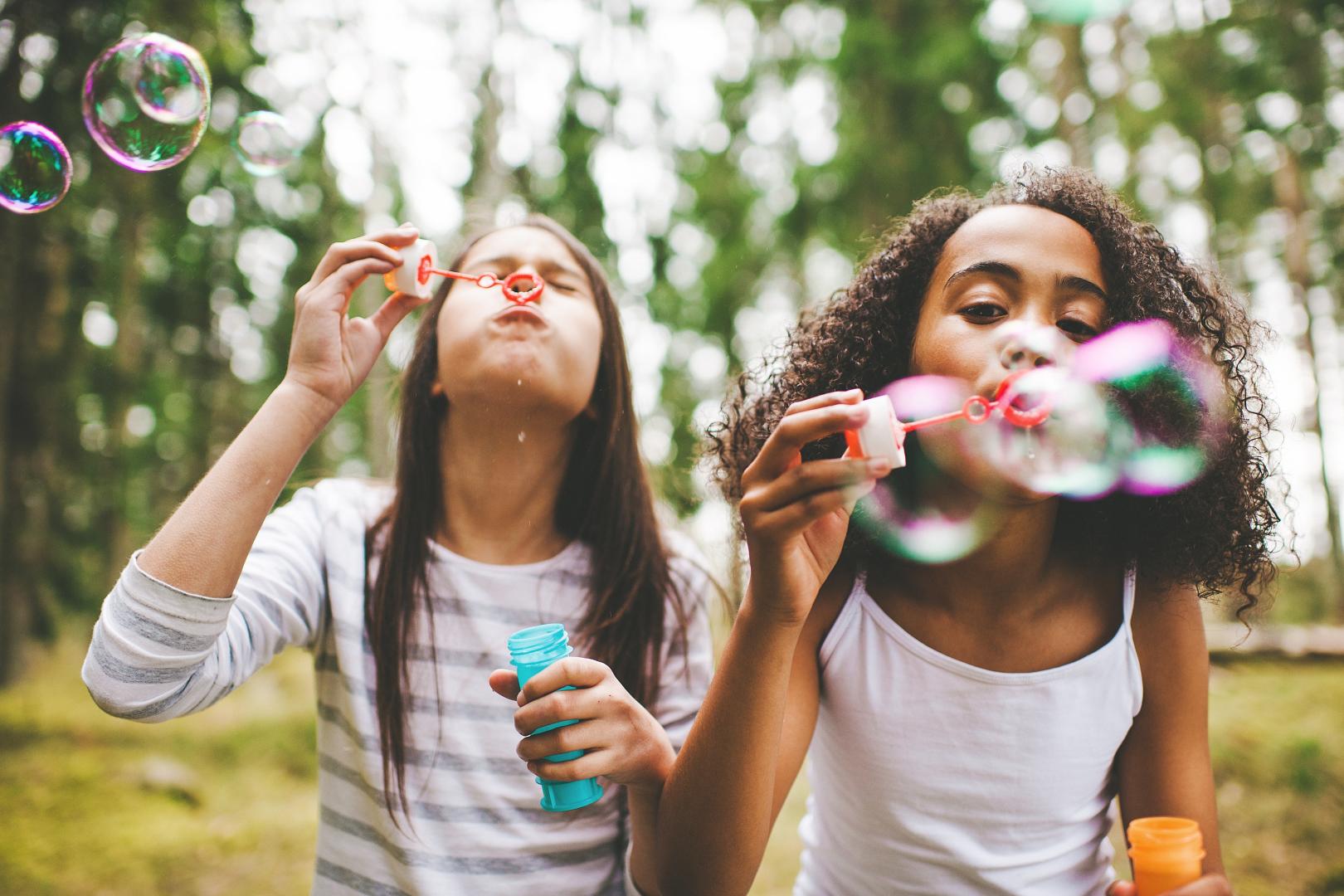 girls blowing bubbles