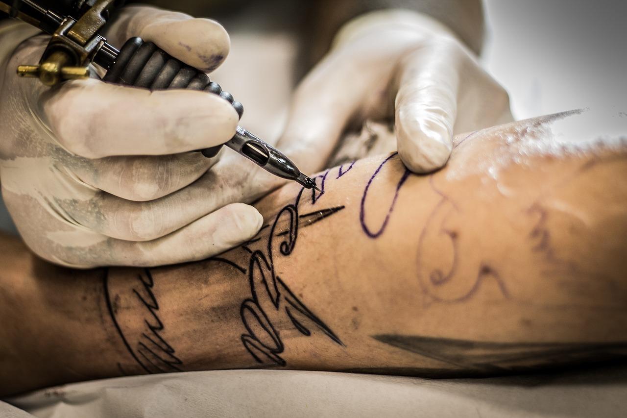 Tattoo Artist with tattoo machine