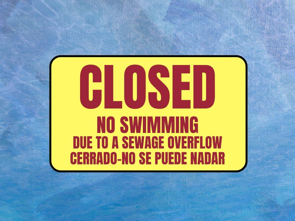 Closed - No Swimming due to a sewage overflow. Cerrado - no se puede nadar