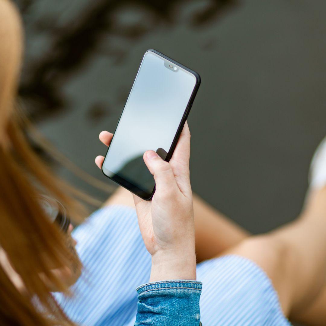 Person holding a mobile phone